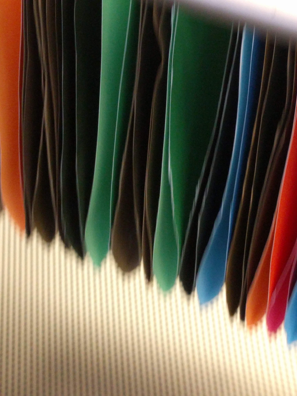 File folders on a rack.